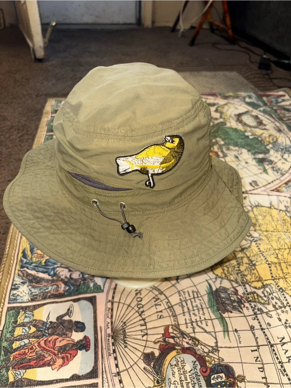The North Face Olive Green Bucket Hat with Yellow Bird Patch